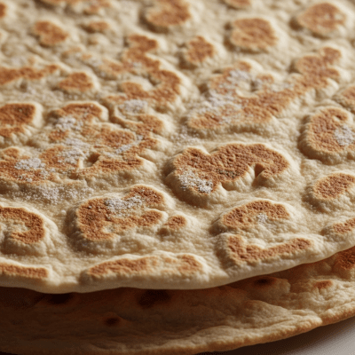Macro photograph focusing on the crust and surface texture of Tortilla