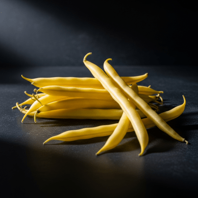 Editorial-style photograph of Wax Bean, part of the taxonomy beans, arranged aesthetically on a dark background with dramatic lighting to highlight its shape and color.