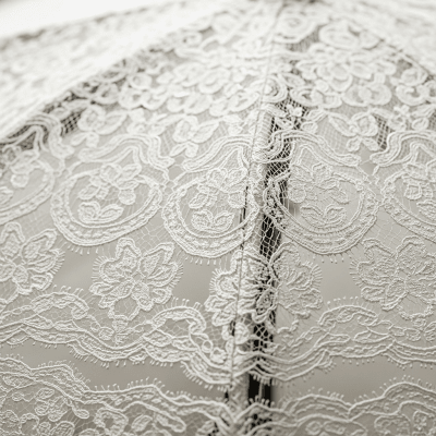 A close-up macro photograph focusing on the texture and pattern of the canopy fabric of a Wedding Umbrella (umbrellas)