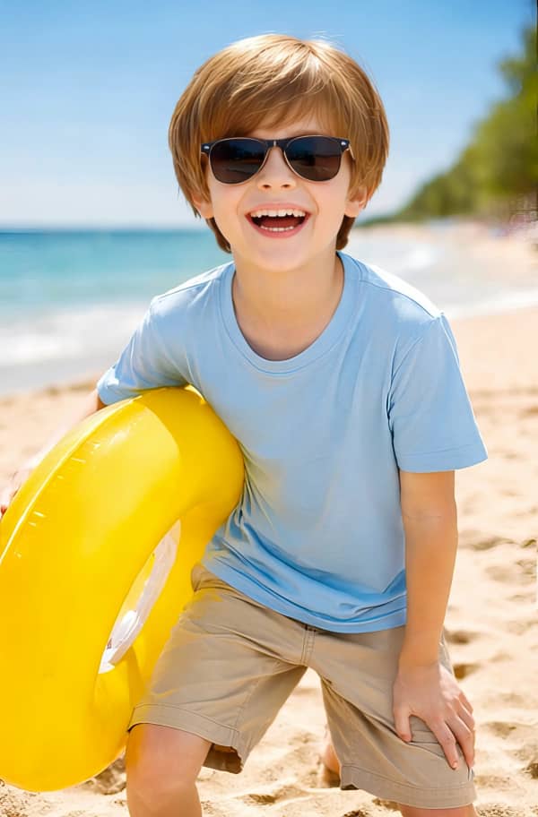Boy sitting on beach