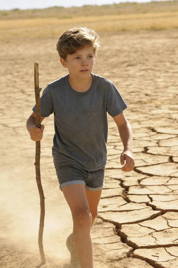 Boy with walking stick