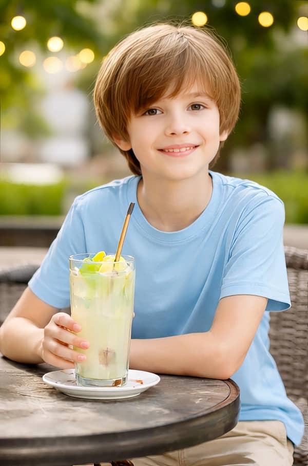 Boy sitting with drink