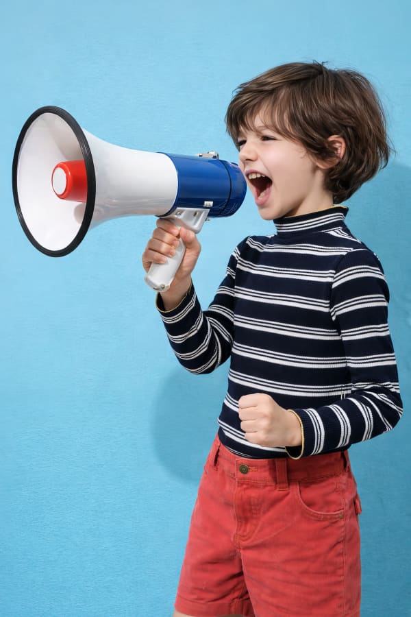 Boy shouting into megaphone