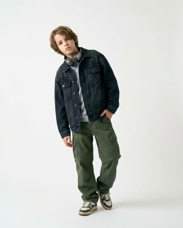 Boy in denim jacket studio