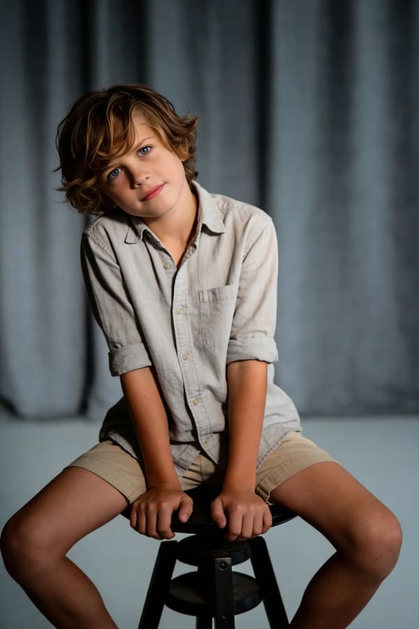 Boy sitting on stool