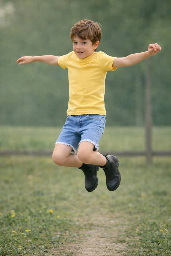 Boy jumping in air
