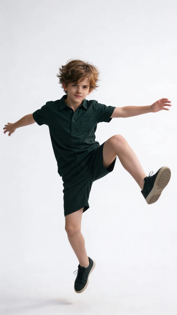 Boy jumping in studio