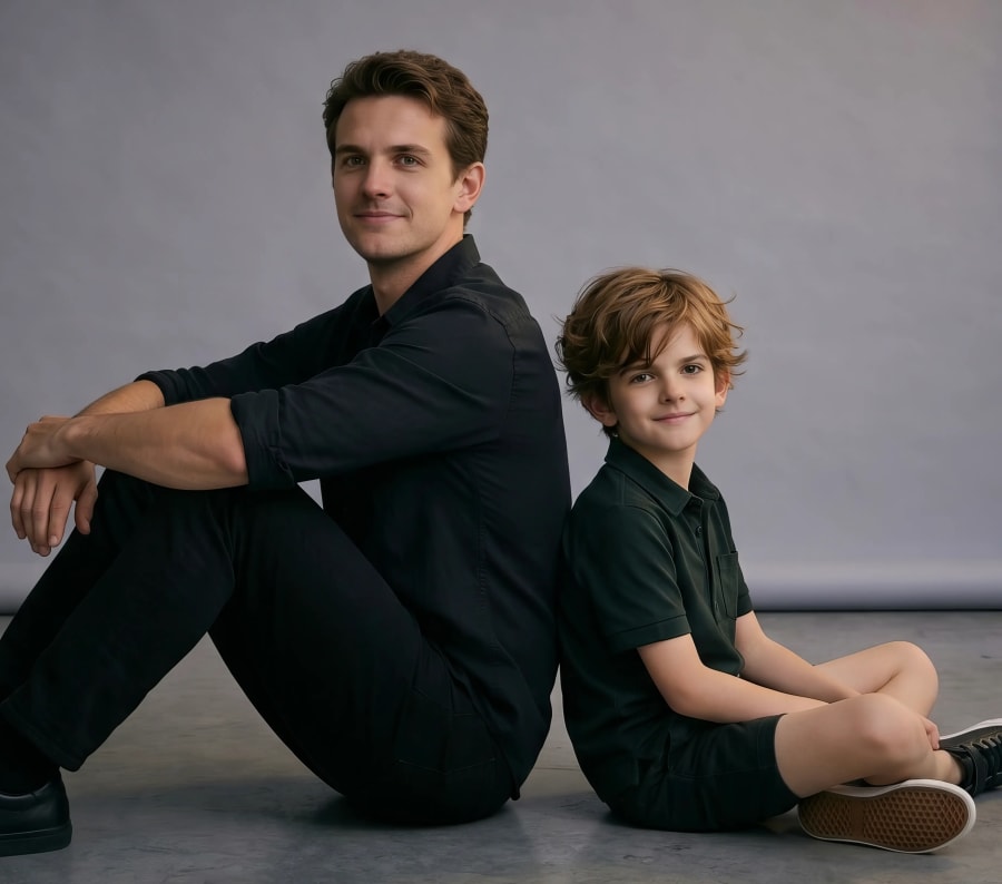 Father and son sitting stock photo