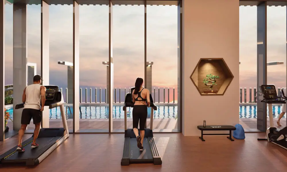 Two individuals using treadmills in a modern gym with large windows and a pool view.