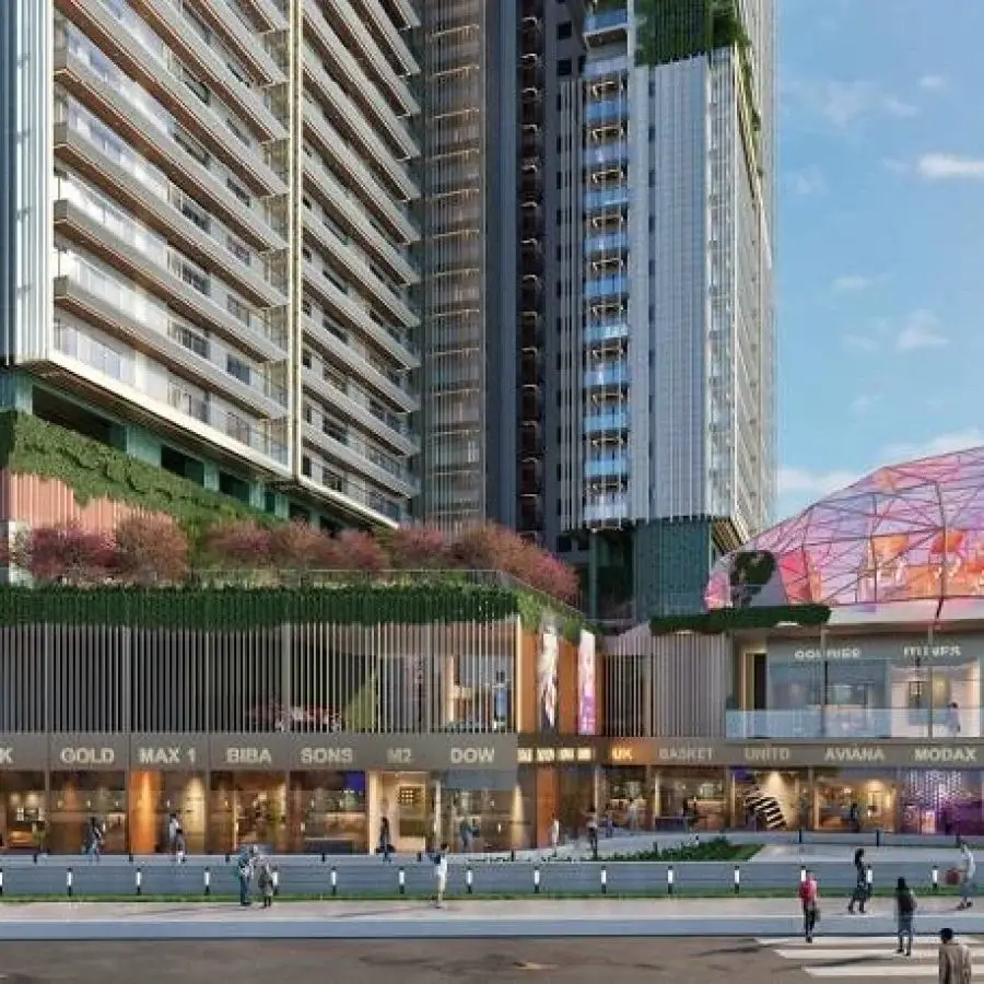 Modern twin towers with greenery, shops at the base, and people walking nearby.