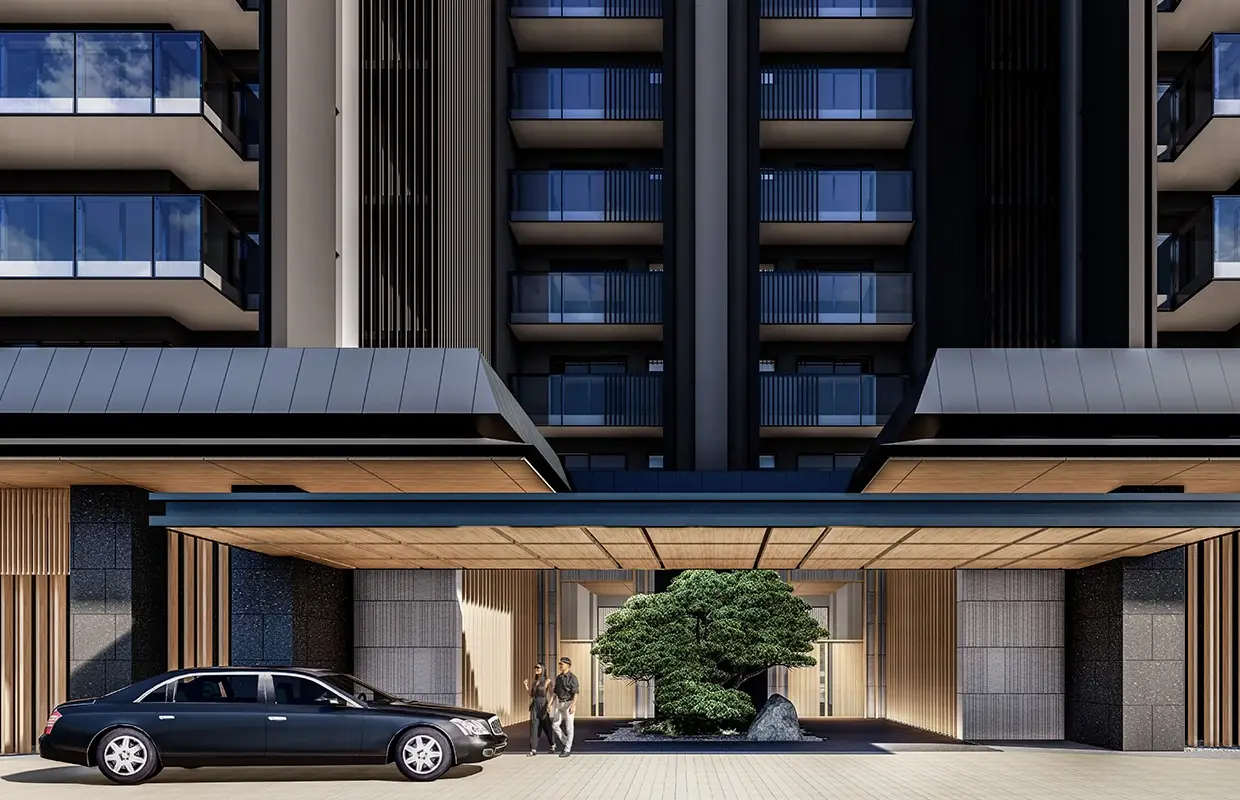 Modern building entrance with a car, two people, and a landscaped garden feature.