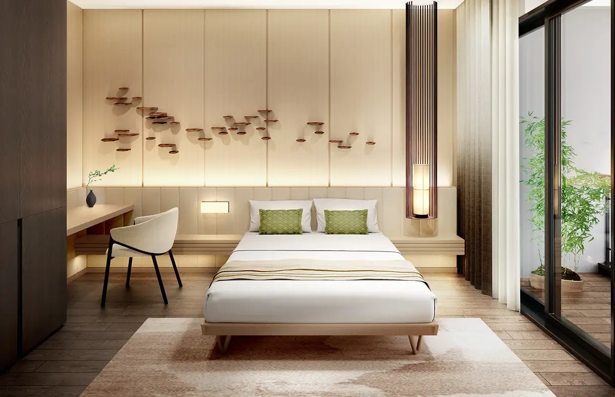 Modern bedroom with a bed, green cushions, desk, chair, and sliding glass door to a balcony.