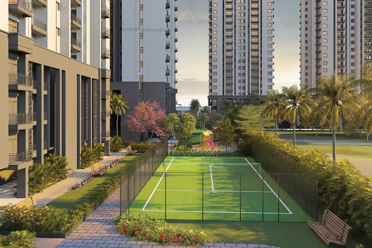 View of a tennis court surrounded by greenery and modern apartment buildings.
