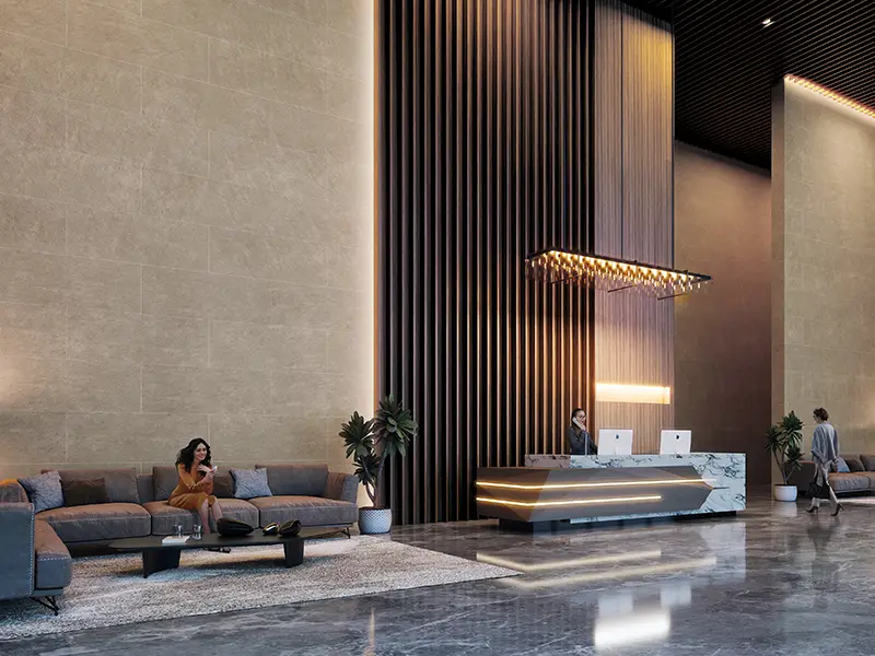 Spacious lobby with modern seating, reception desk, and decorative lighting features.