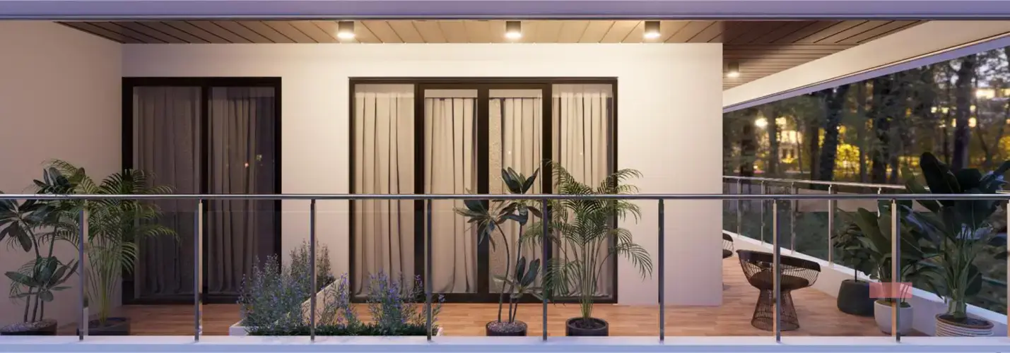 Modern balcony with potted plants, curtains, and seating area, illuminated by ceiling lights.