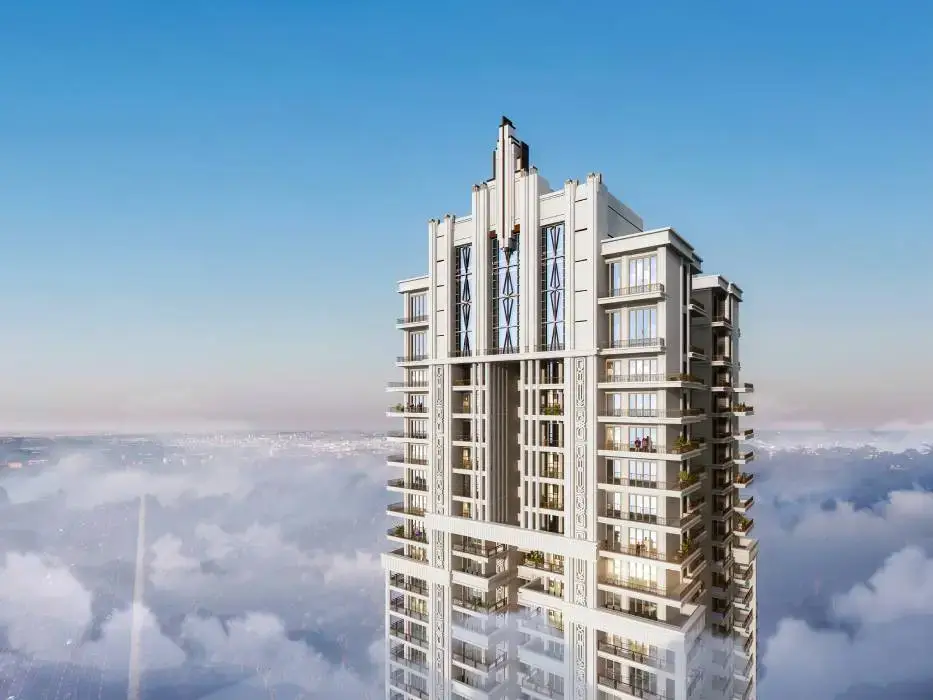 Tall modern building with balconies and a distinctive architectural design against a clear blue sky.
