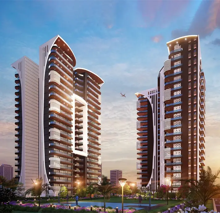 Three modern residential buildings with unique architectural designs, surrounded by greenery and a sunset sky.