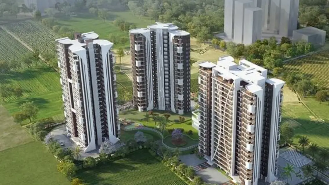 Three modern residential towers surrounded by greenery and landscaped gardens.