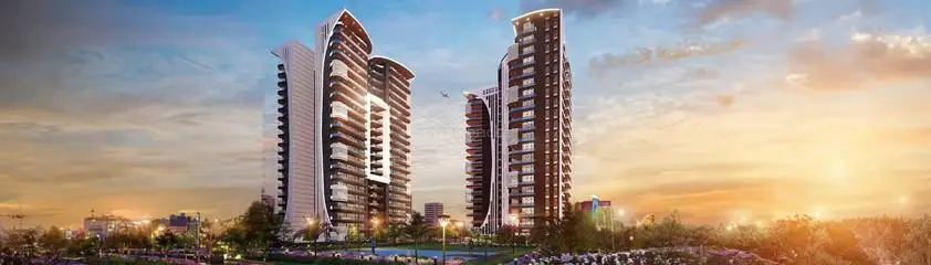 Three contemporary residential towers with unique designs against a sunset sky and greenery.