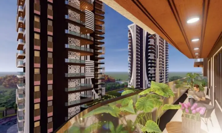View from a balcony featuring modern buildings, greenery, and a person relaxing with a book.