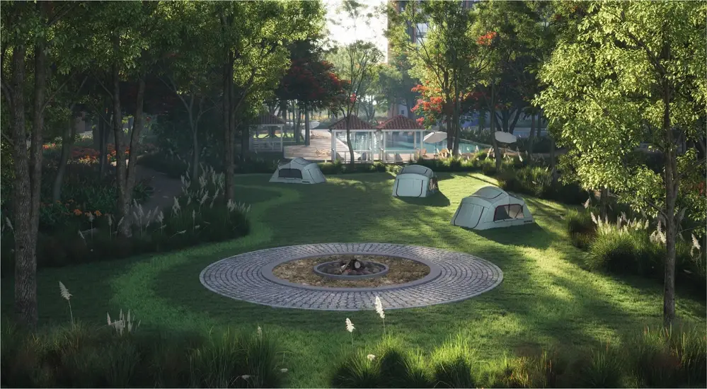 A serene camping area with tents, a circular stone fire pit, and lush greenery.