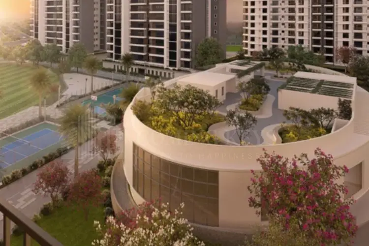 Modern residential buildings with landscaped gardens and tennis courts in the foreground.