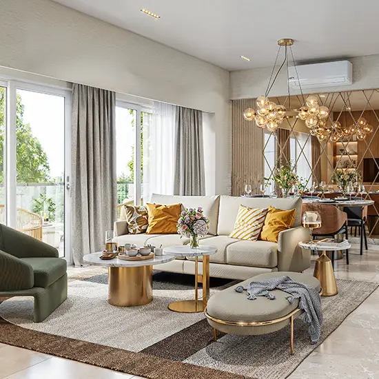 Modern living room featuring a beige sofa, decorative pillows, coffee table, and large windows.