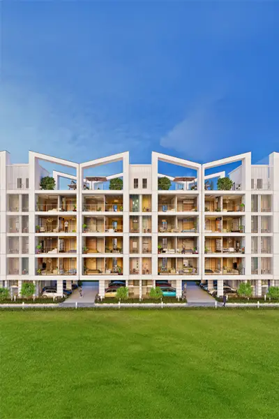 Contemporary apartment building with multiple balconies and green landscaping in front.