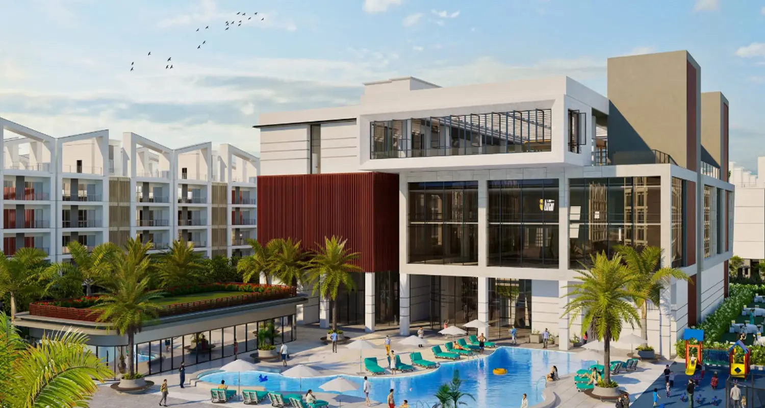 Modern building with large glass windows, pool, palm trees, and outdoor seating area.