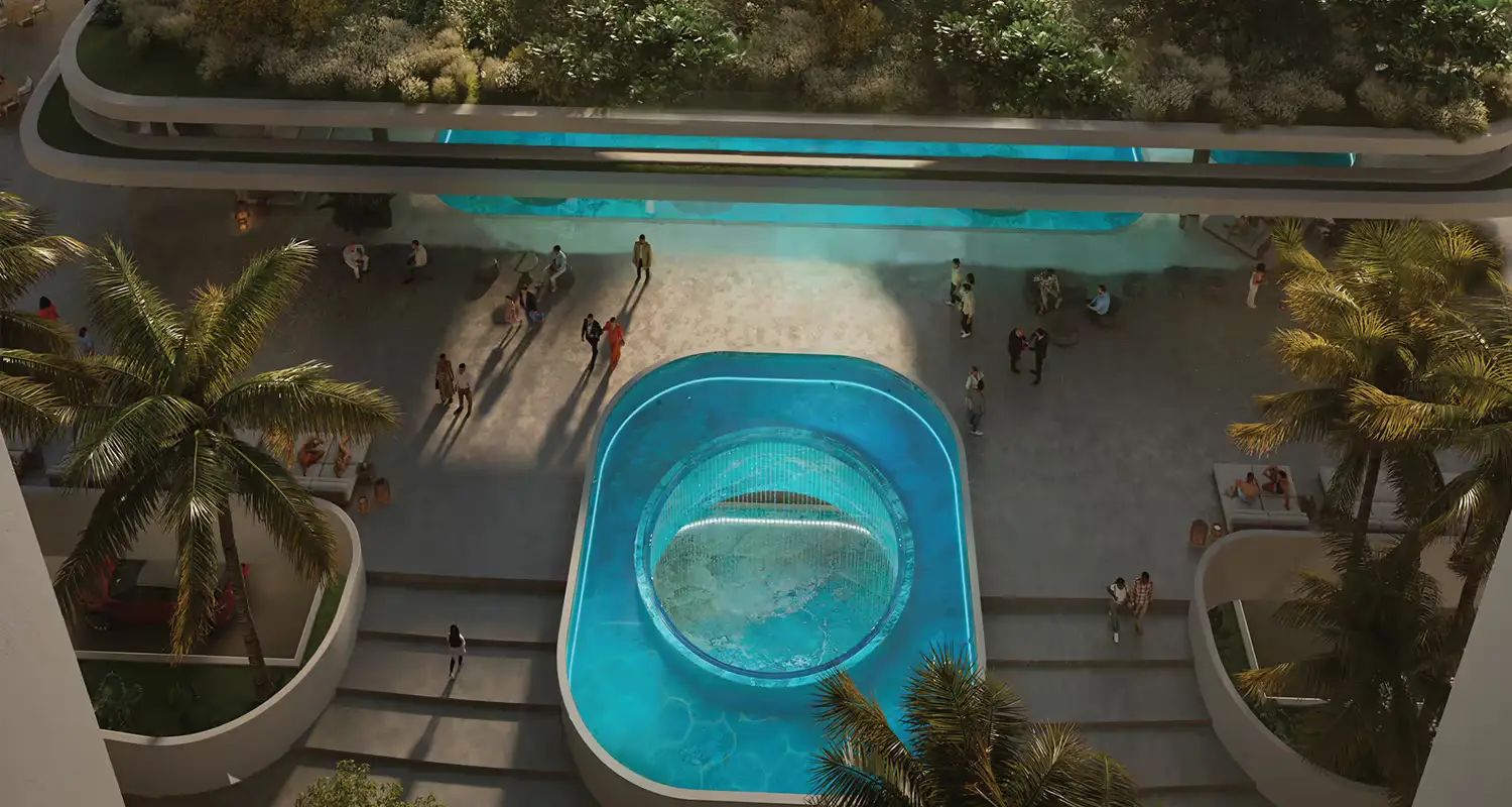 Aerial view of a circular swimming pool surrounded by palm trees and people.