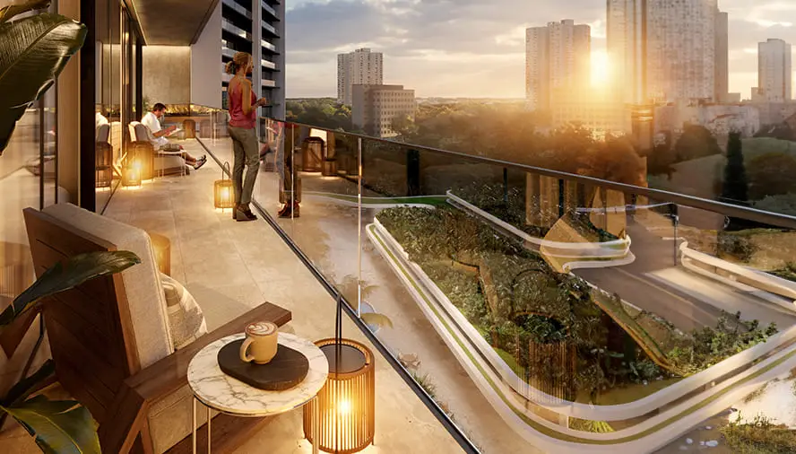 Modern balcony with seating, plants, and a view of buildings and sunset.