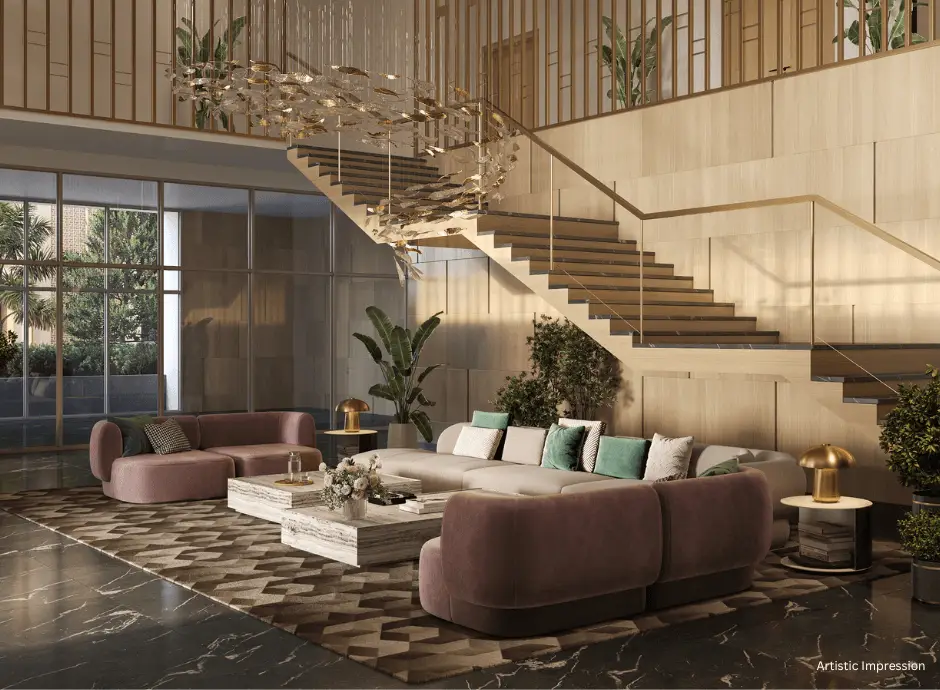 Spacious lobby with a staircase, plush seating, plants, and decorative lighting.