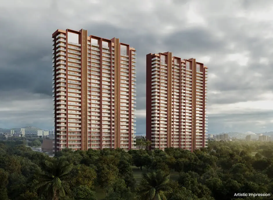 Two tall residential towers with balconies surrounded by green trees and cloudy sky.