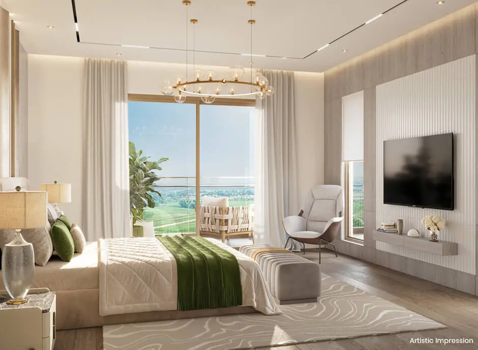Spacious bedroom with large window, green accents, chandelier, and comfortable seating area.