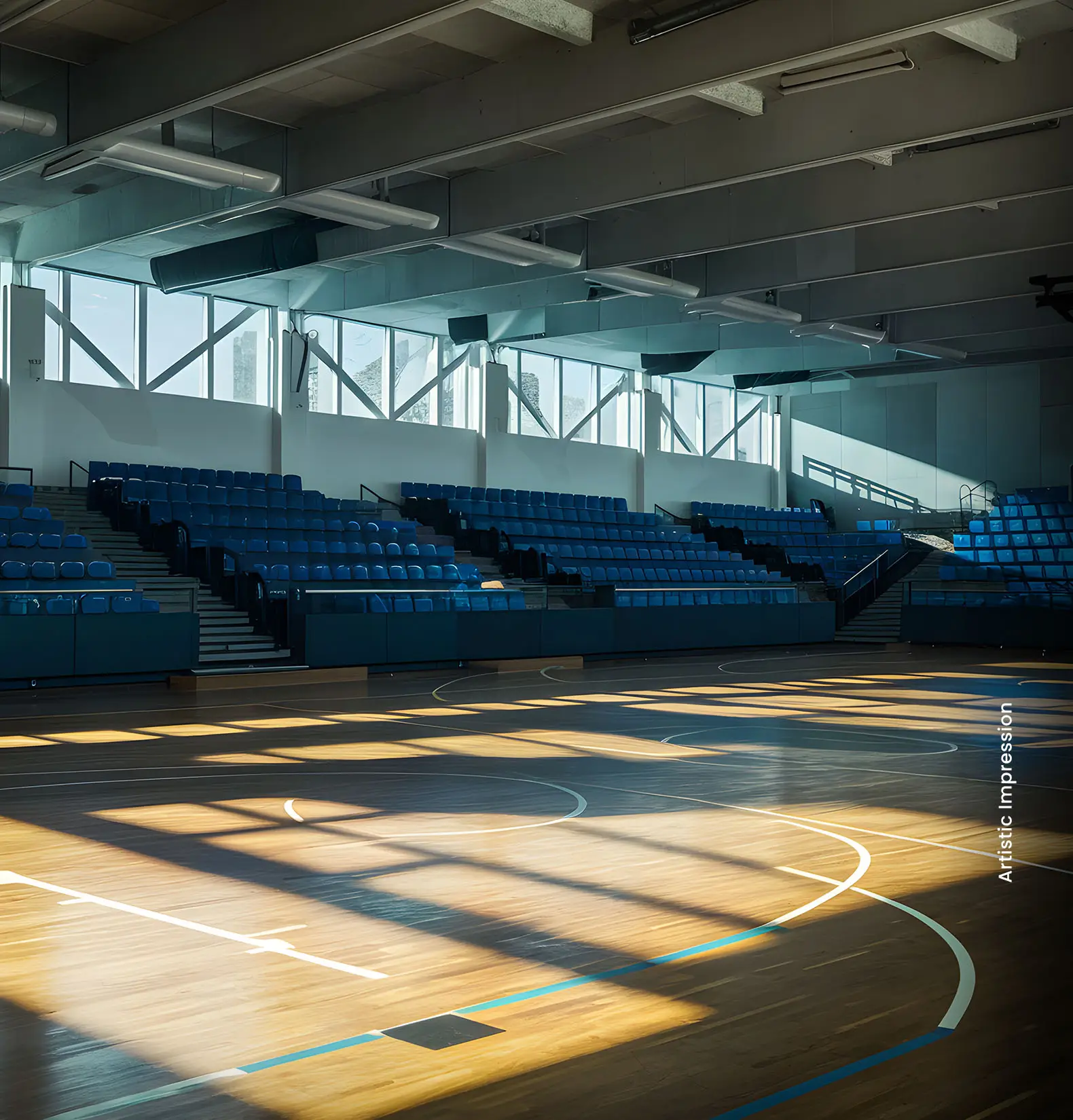 Interior view of a sports arena with blue seating and wooden floor, sunlight casting shadows.