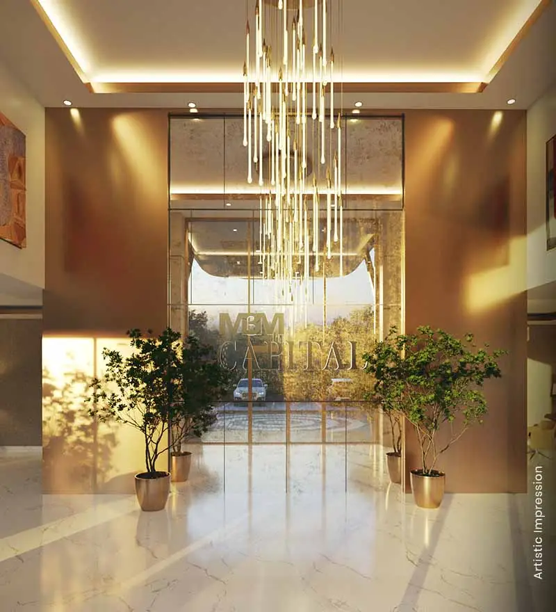 Modern lobby with elegant chandelier, plants in pots, and large glass entrance.