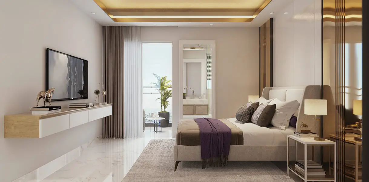 Spacious bedroom featuring a bed with decorative pillows, a TV, and a balcony view.