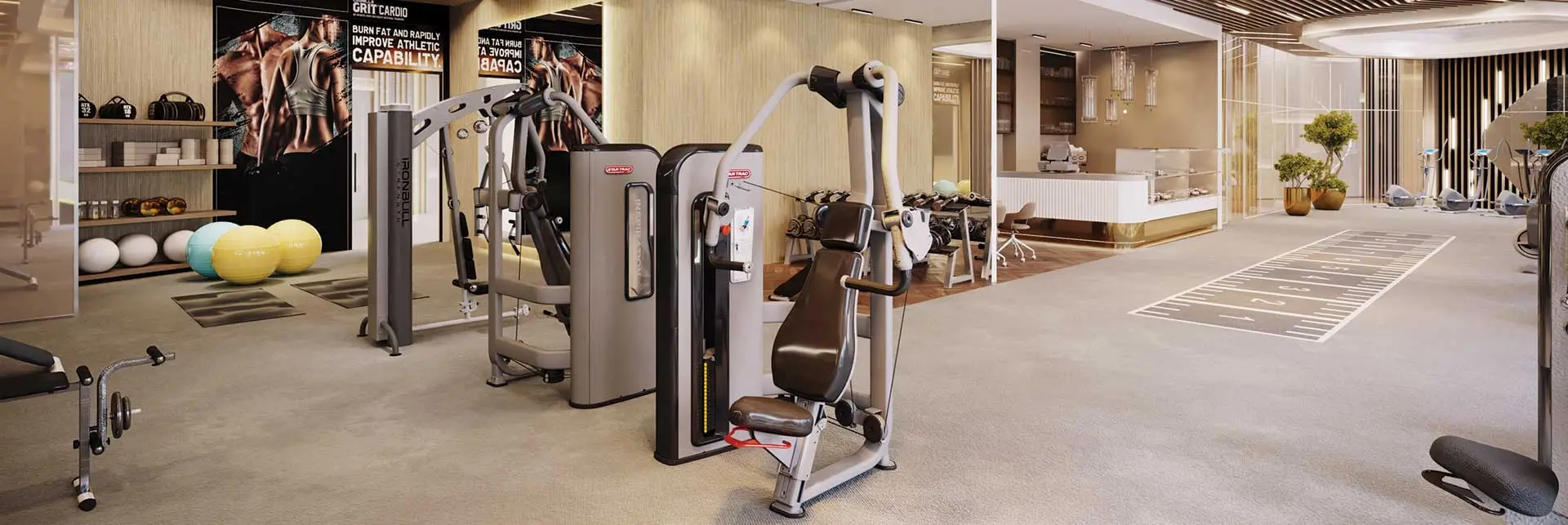 Modern gym with exercise machines, fitness equipment, and a well-lit space.