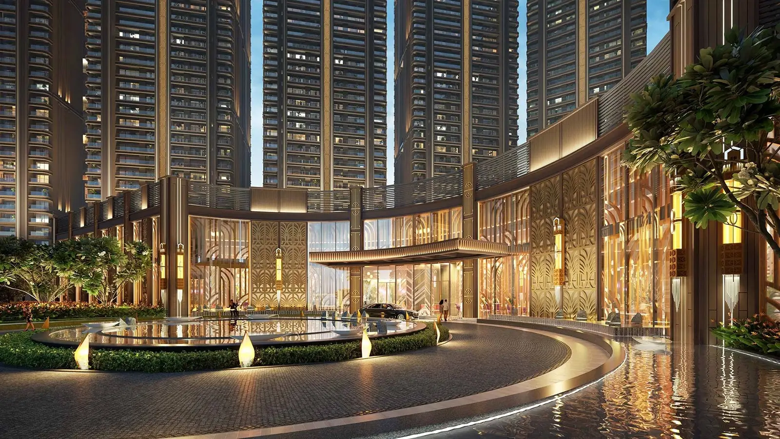 Luxurious building entrance with water features, palm trees, and tall residential towers in the background.