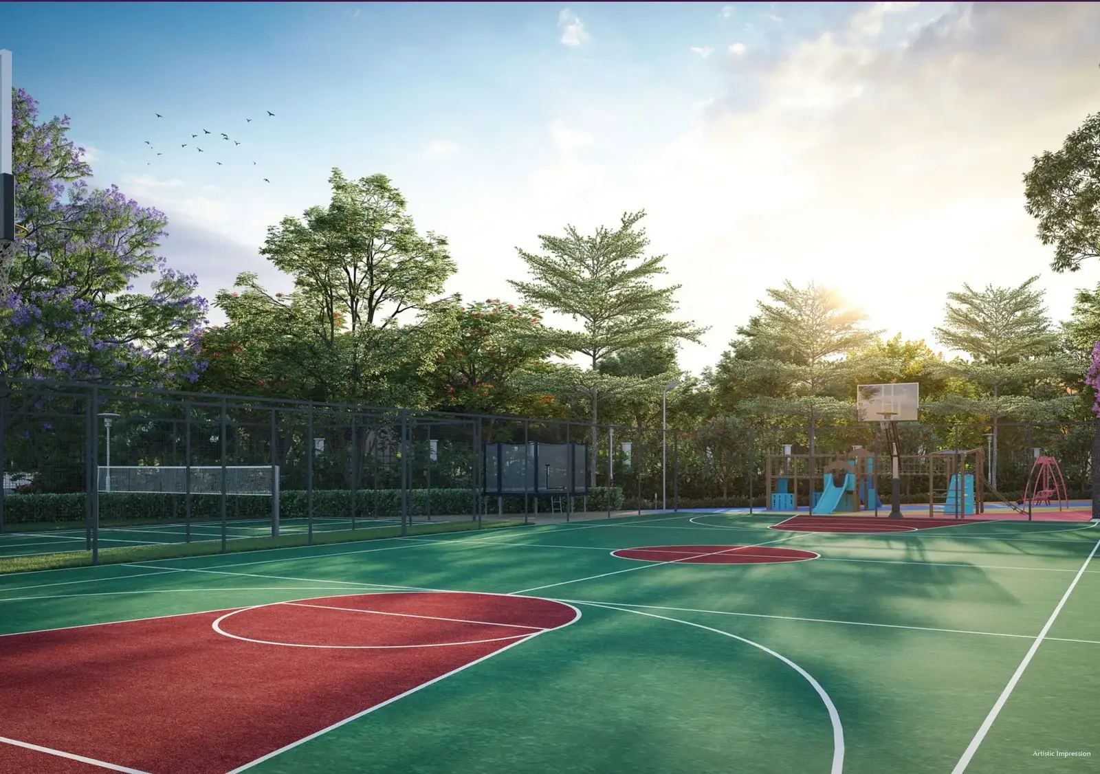 Basketball court with red and green markings, surrounded by trees and playground equipment.