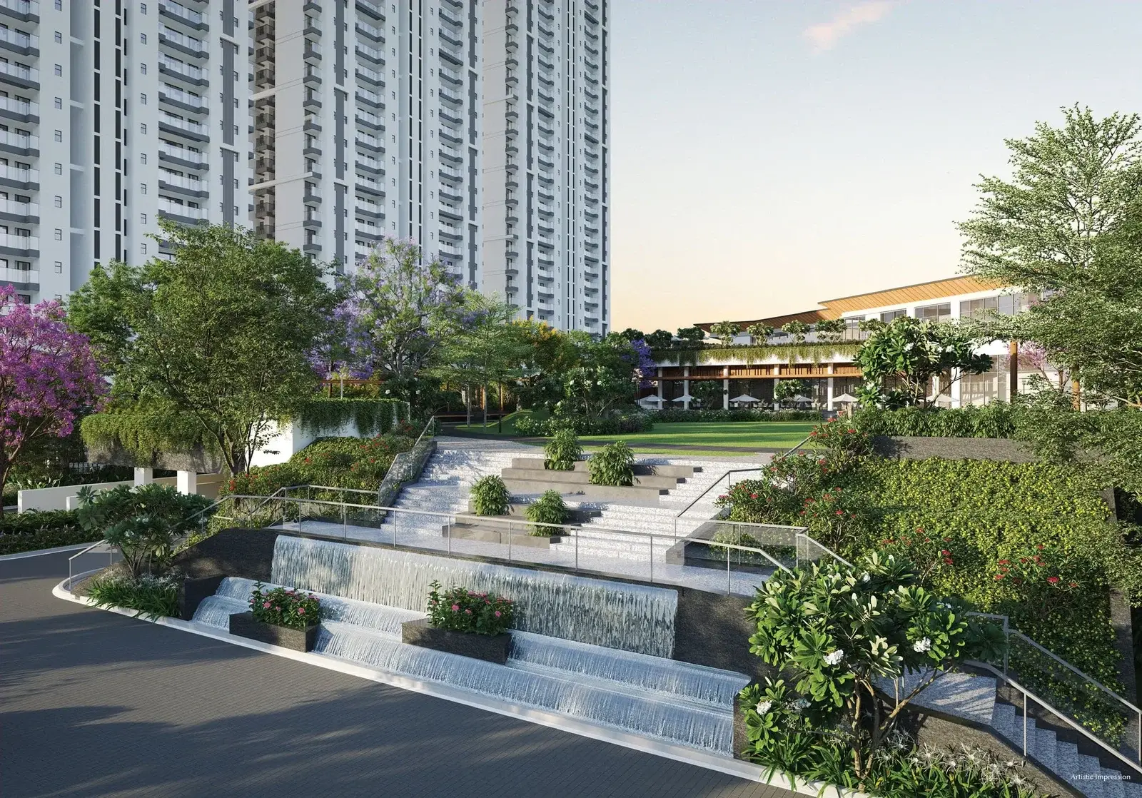 Modern residential building with landscaped gardens, waterfalls, and vibrant greenery.