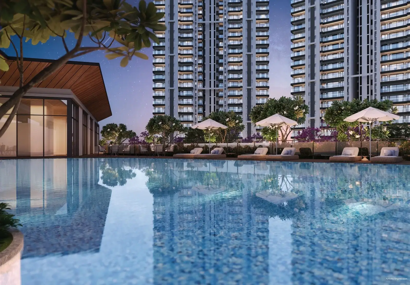 Swimming pool with loungers and umbrellas, modern buildings in the background, evening sky.