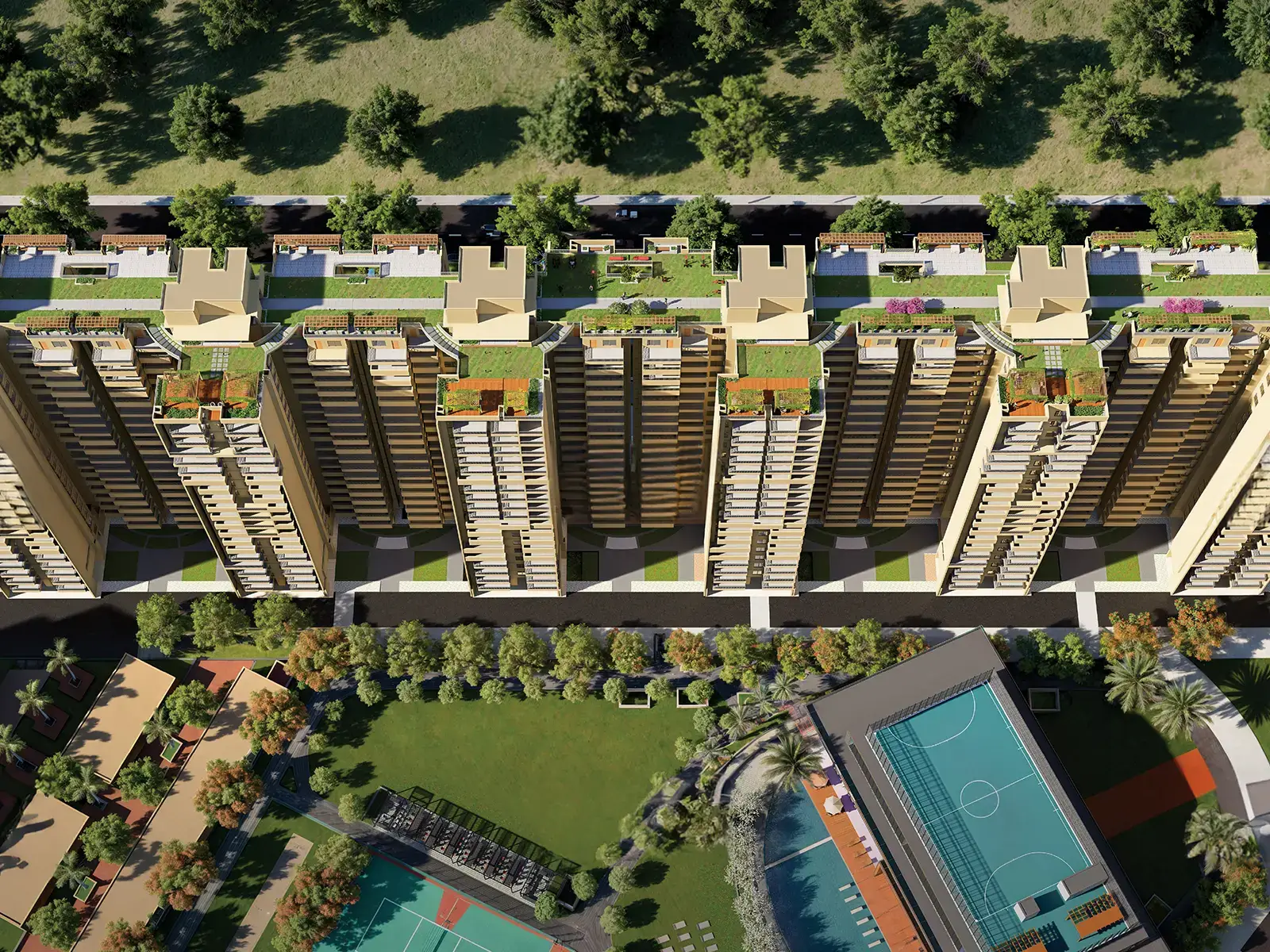 Aerial view of multiple residential towers with green roofs, surrounded by trees and sports facilities.