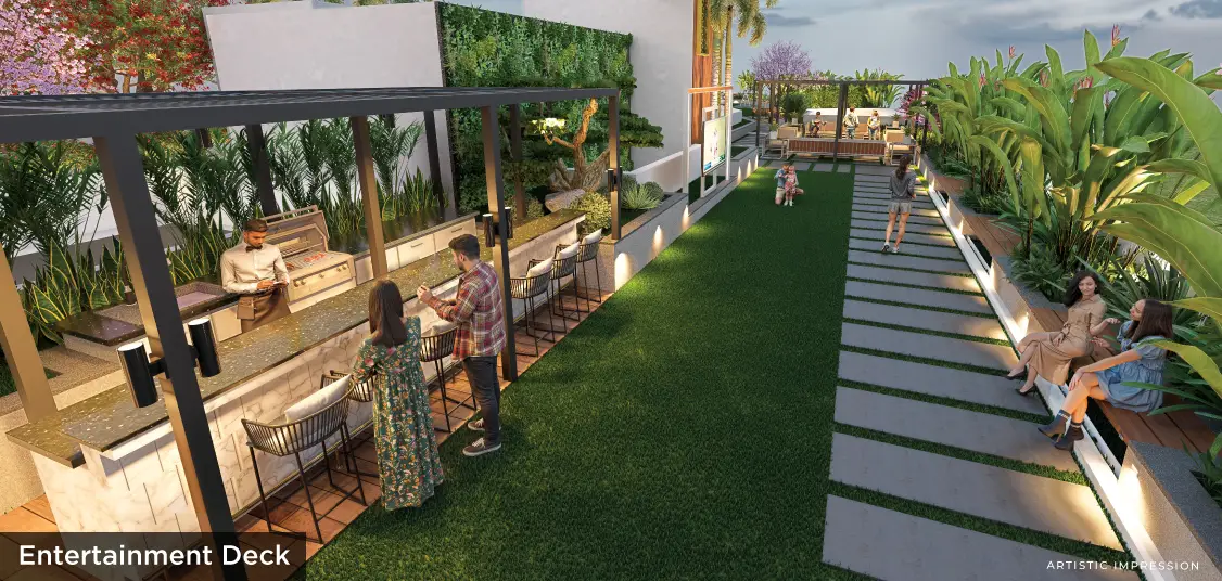 A landscaped outdoor area with seating, bar, and pathways surrounded by greenery and plants.