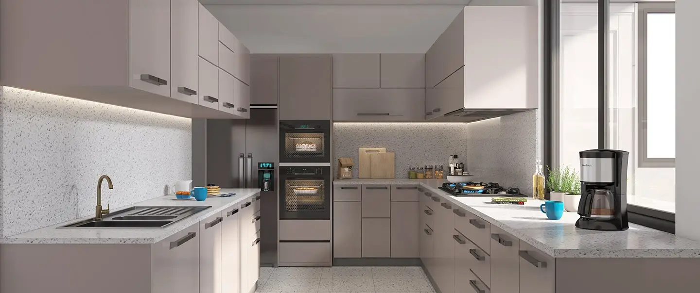 Contemporary kitchen with light cabinets, countertop, appliances, and a coffee maker.