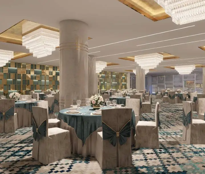 Elegant restaurant interior with round tables, floral centerpieces, and crystal chandeliers.