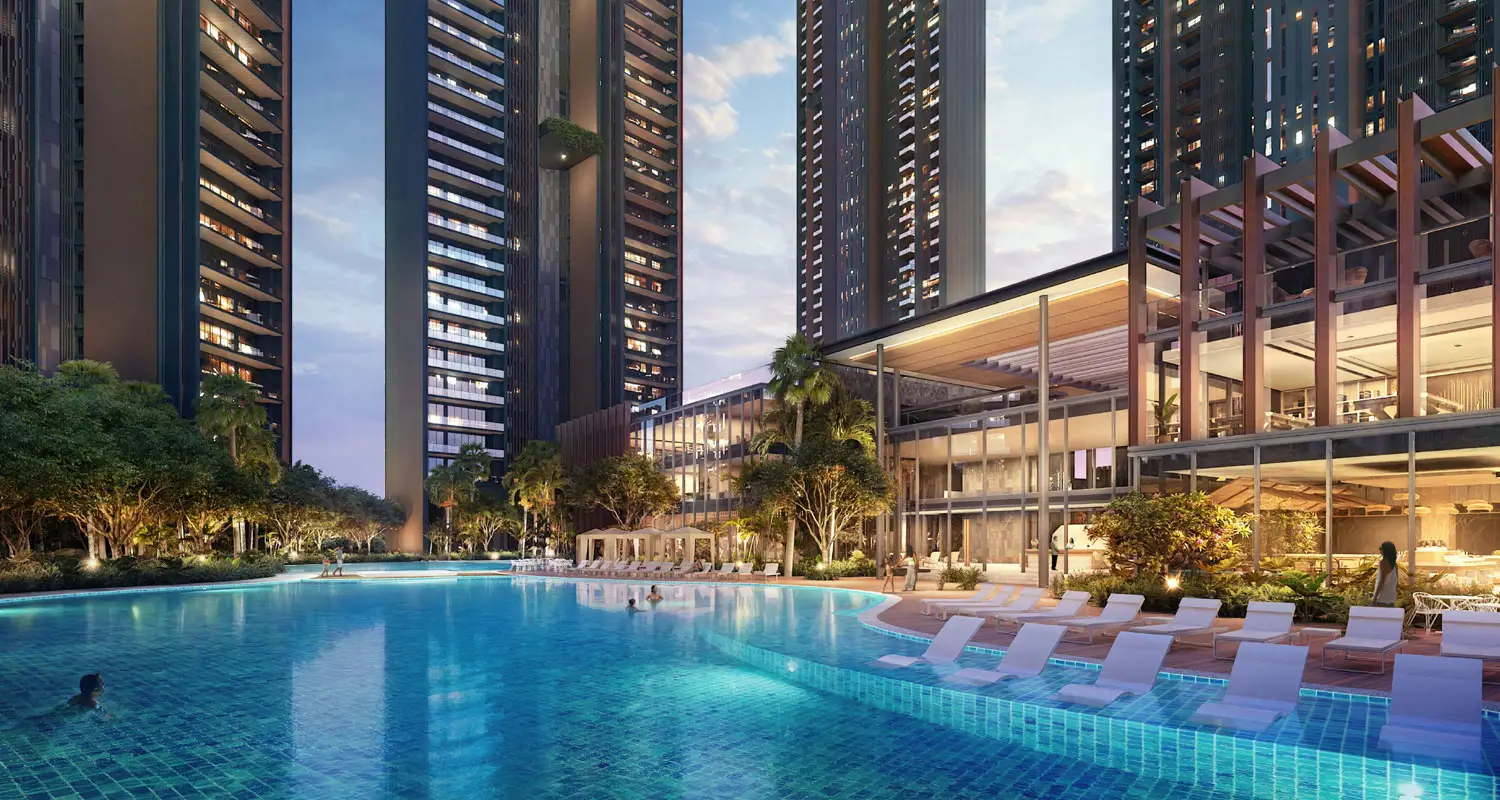 Modern high-rise buildings surrounding a large swimming pool with lounge chairs and landscaped greenery.