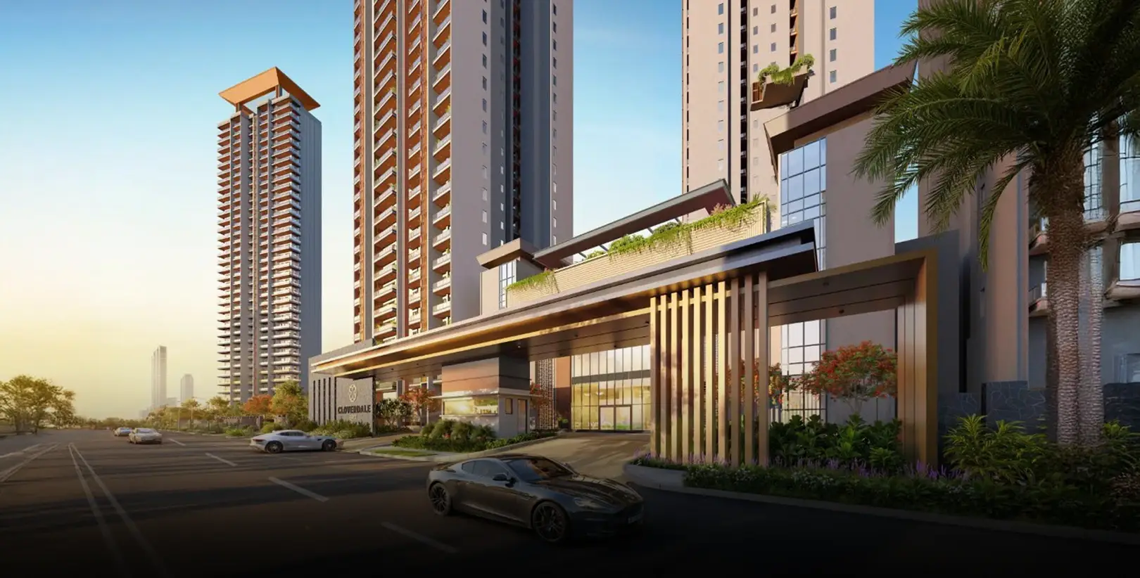 Modern residential towers with a landscaped entrance, palm trees, and parked cars in the foreground.