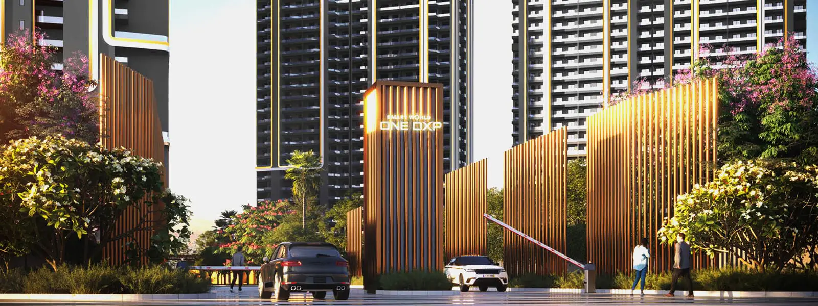 Modern entrance with tall buildings, golden accents, greenery, and parked cars.