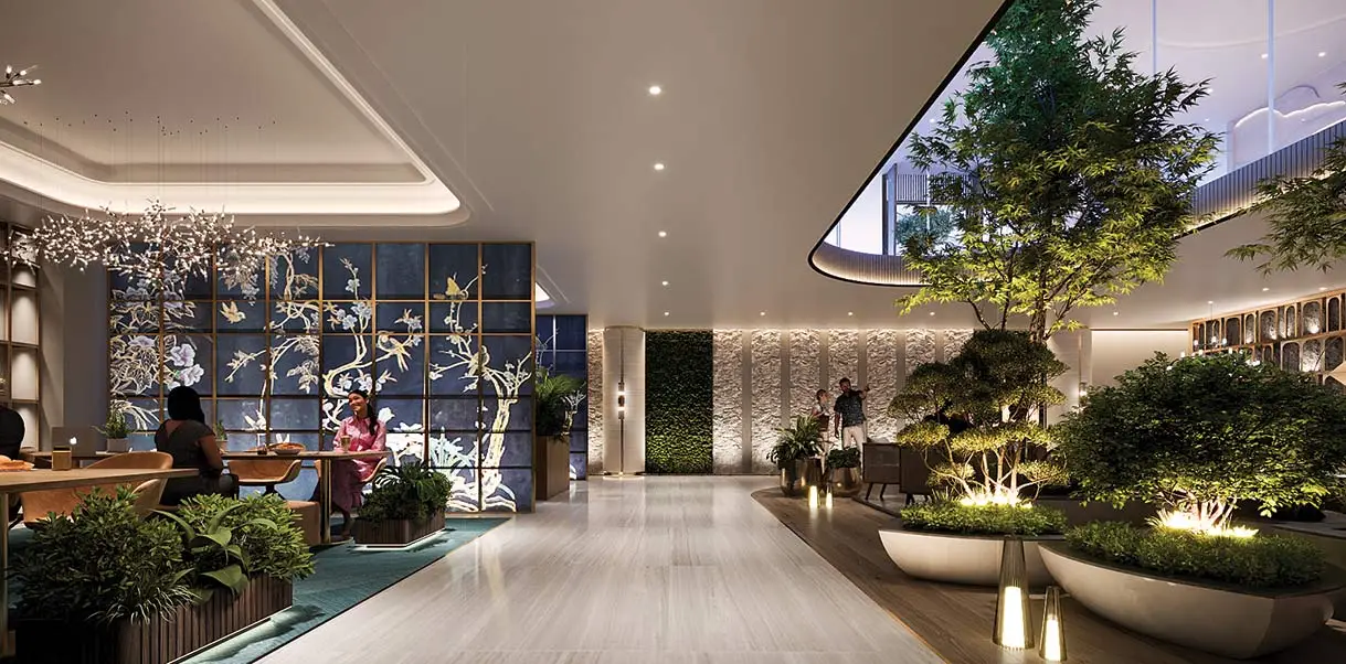 Modern lobby featuring greenery, decorative wall, seating area, and stylish lighting.